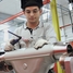 Employee assembling flow measurement device at division Itatiba/Brazil.