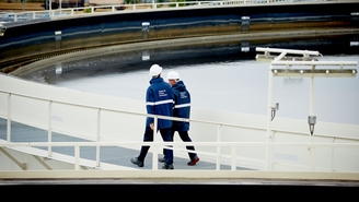 Workers at the wastewater treatment plant of a refinery