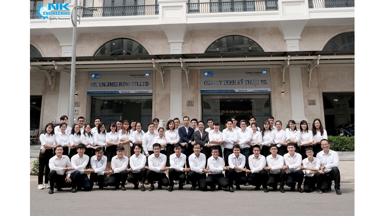 Team of NK Engineering in front of the office